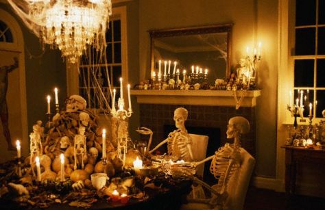 ca. 1995, Shreveport, Louisiana, USA --- Skeletons sits at a dining room table during a Halloween party at the home of William Joyce, well-known children's writer and illustrator. --- Image by © Philip Gould/CORBIS